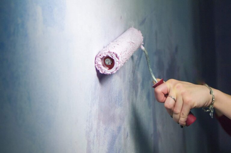 a-woman-paints-the-wall-with-a-painting-tool-1-1.jpg